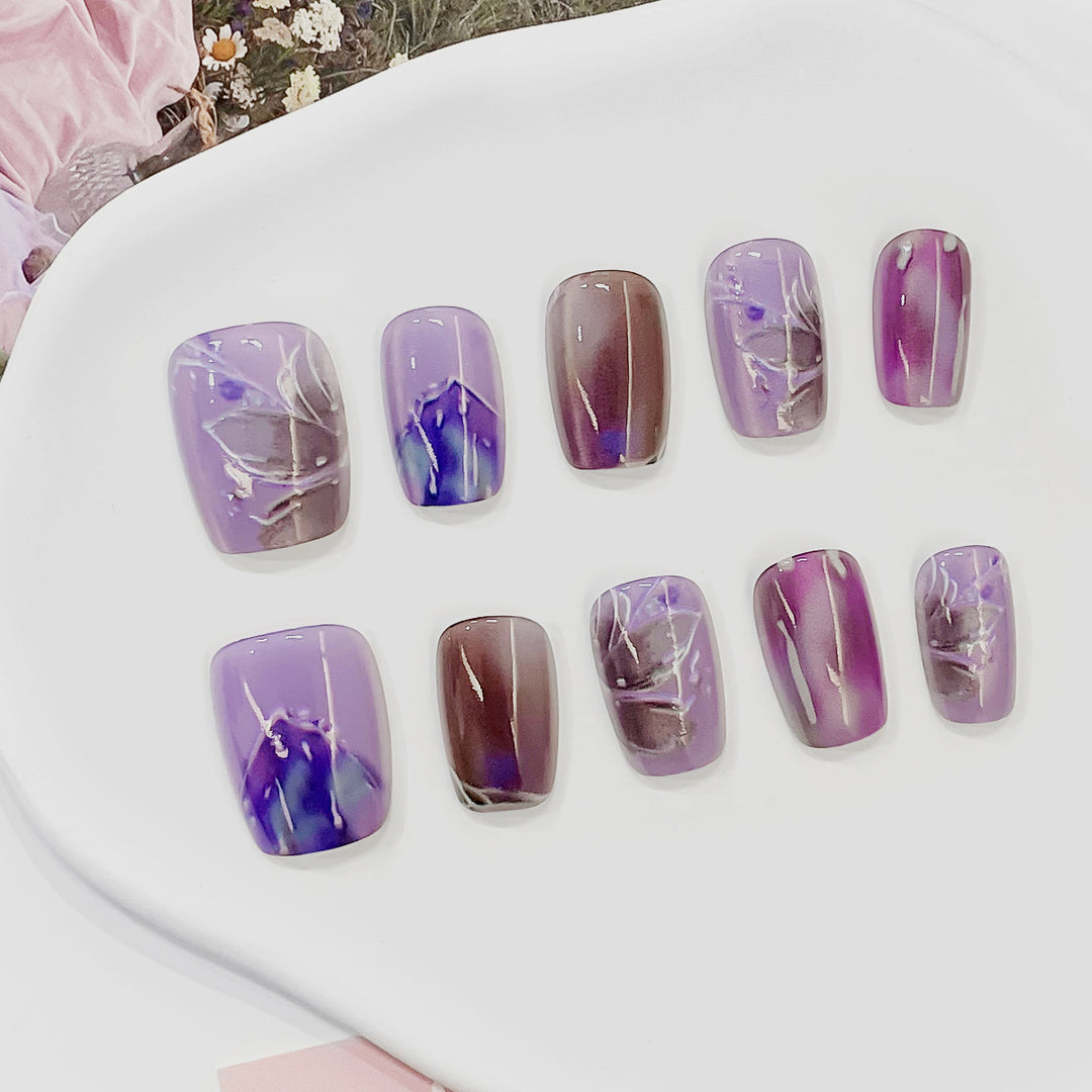 Artful acrylic nails with marbled design Kalsten
