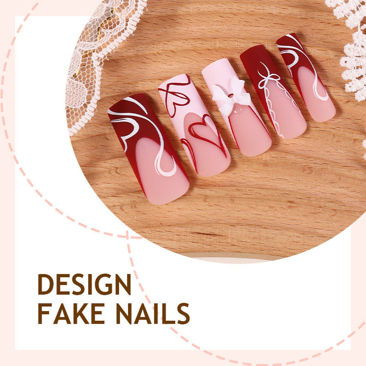 artistic nail set with heart and bow motifs Kalsten