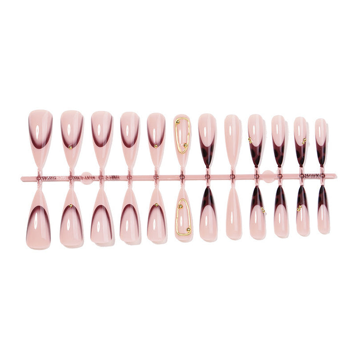 Acrylic nail set with elegant ombre design and golden accents Kalsten