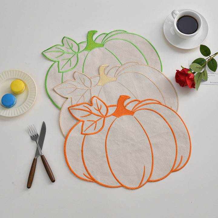 Seasonal table mat placemat made of linen in pumpkin silhouette with colorful embroidered border