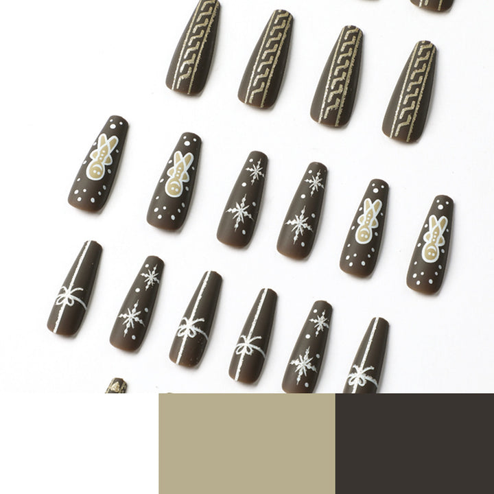 Artificial nail art with festive gingerbread design Kalsten