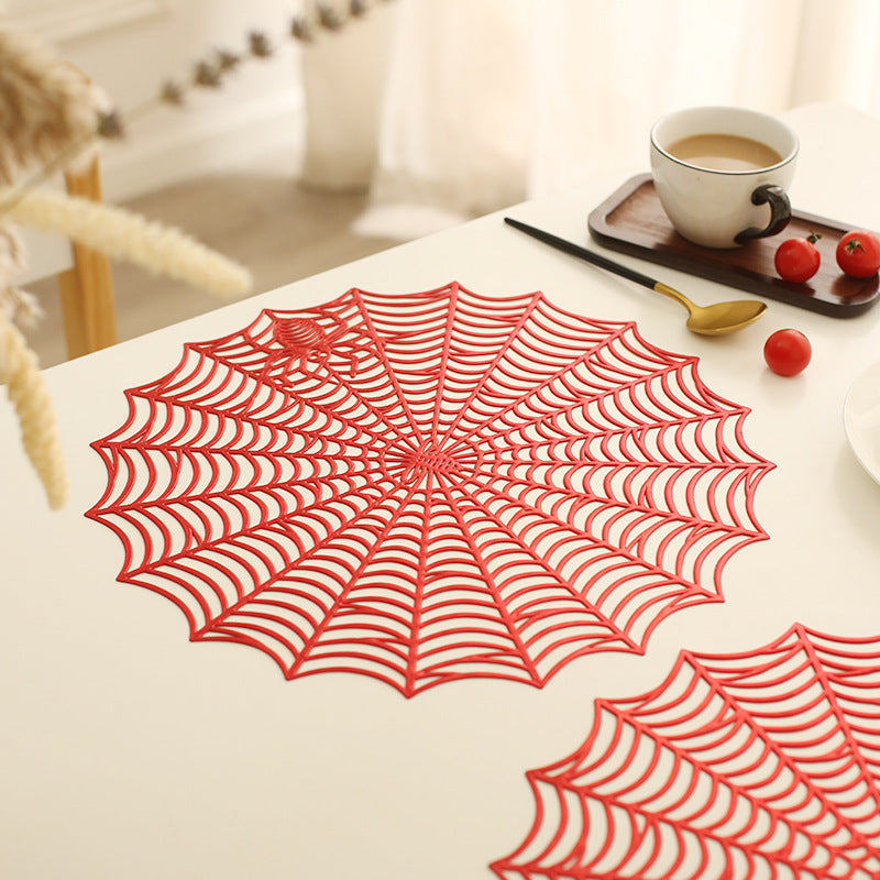 Round filigree spider web placemat made of heat- and water-repellent PVC for table decoration