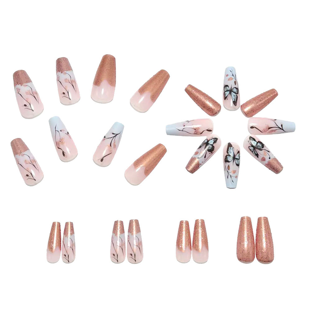 Artificial nails with filigree butterfly design and golden accents Kalsten