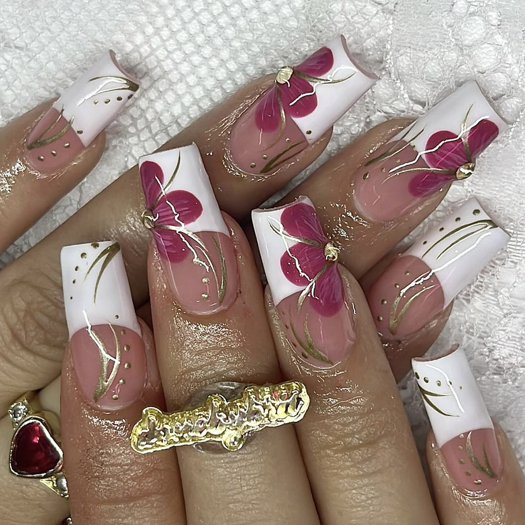 Artificial nail set with floral detail and glitter accents Kalsten