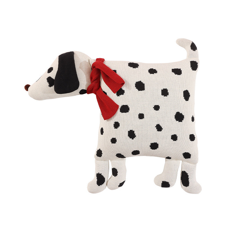 Decorative knitted cuddle pillow in the shape of a dog with a quilted body and bow detail Kalsten