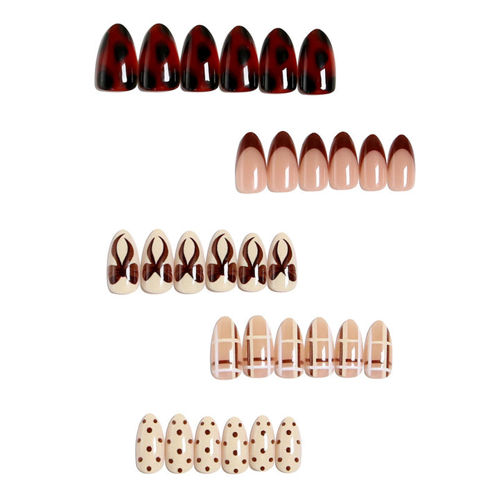 Artificial nail set with elegant bow and caramel designs Kalsten