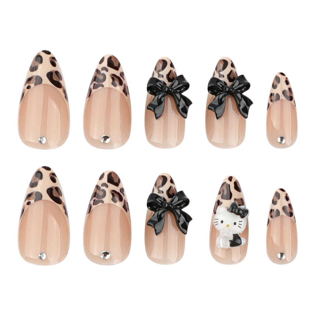Artistic extension nails in leopard pattern with bow accents Kalsten