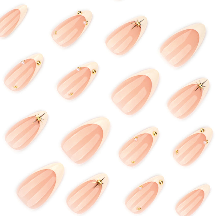 Artistic French-tip nail art with glitter and elegant embellishments Kalsten
