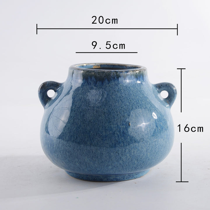 Decorative ceramic pot with playful handles Kalsten