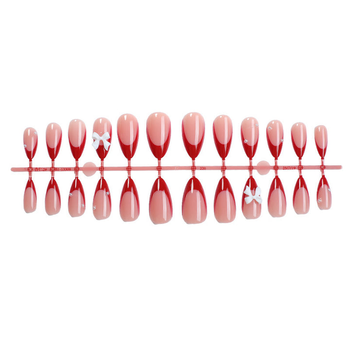 Artificial nail set with elegant bows and glitter accents Kalsten