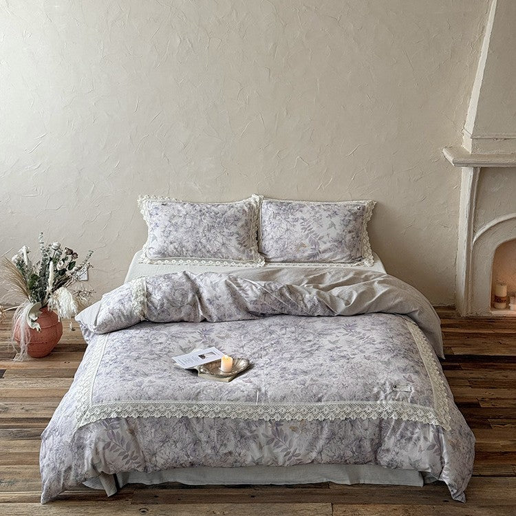 Duvet cover set made of cotton percale with fine lace trim and botanical watercolor pattern
