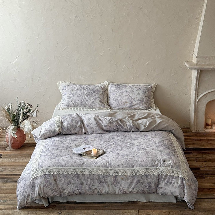 Duvet cover set made of cotton percale with fine lace trim and botanical watercolor pattern