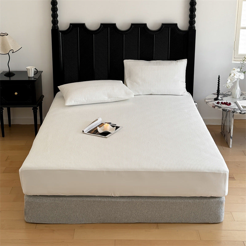 Comfort mattress topper with textured waffle surface and deep edge