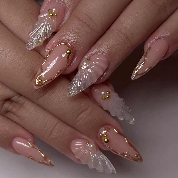 Artful stiletto nails with elegant gold embellishment design Kalsten