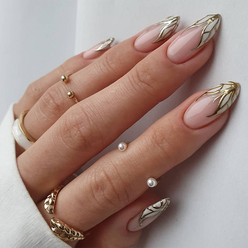 Artful stiletto nails with heart-shaped accents Kalsten