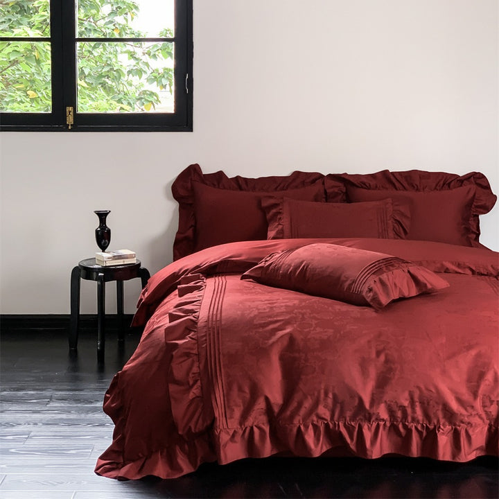 Elegant satin bedding set with ruffles, fine piping and jacquard relief