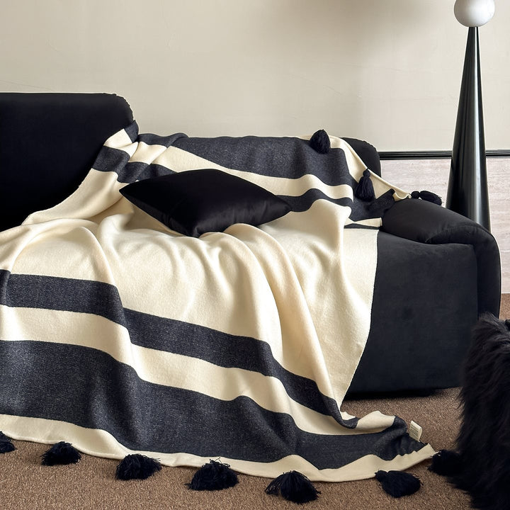 Soft woven blanket with tassels and diagonal stripes