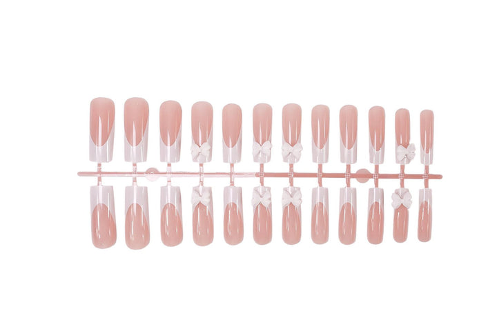 Artificial nail set with shimmering details and cute bows Kalsten