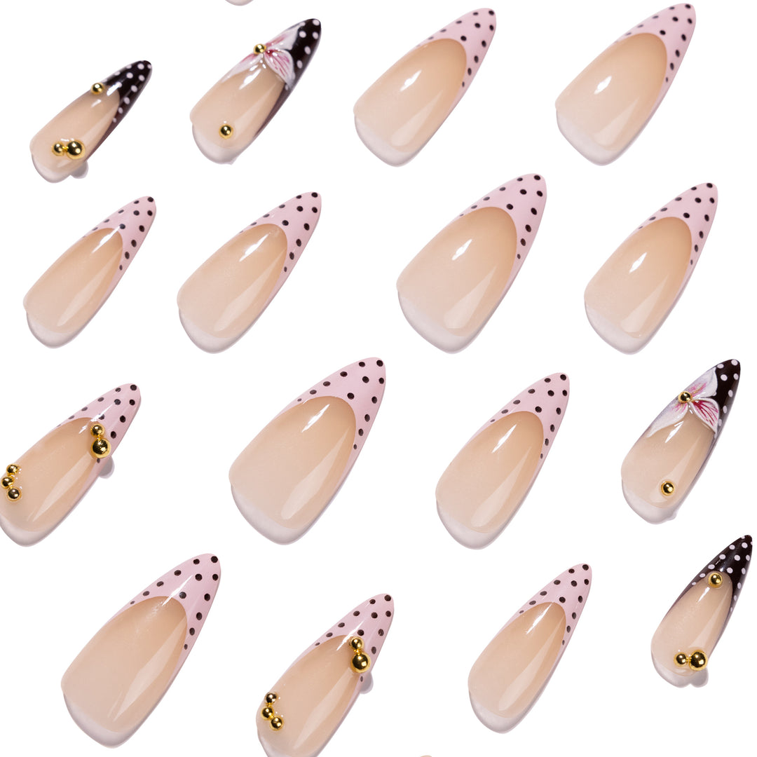 Artful stiletto nails with floral accents and glitter Kalsten
