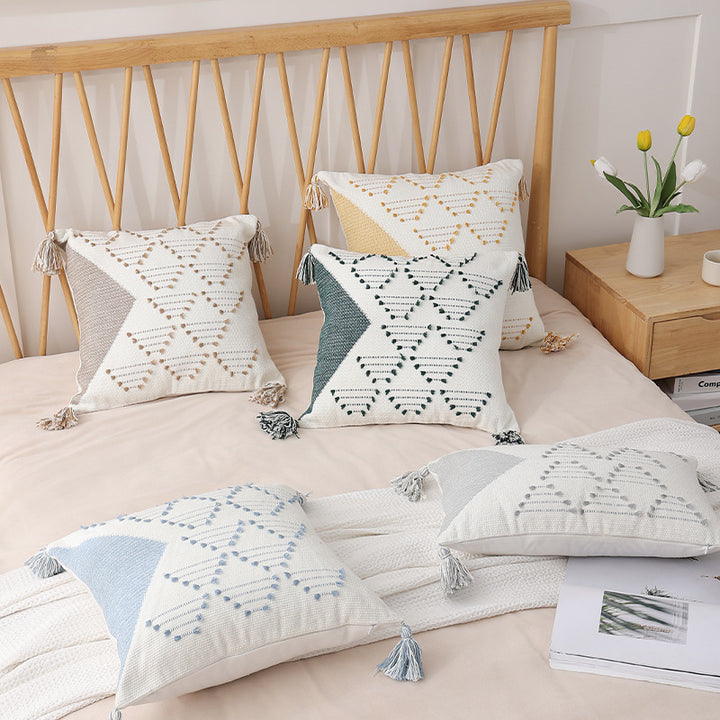 Decorative woven cushion cover with geometric tuft-relief and tassels Kalsten