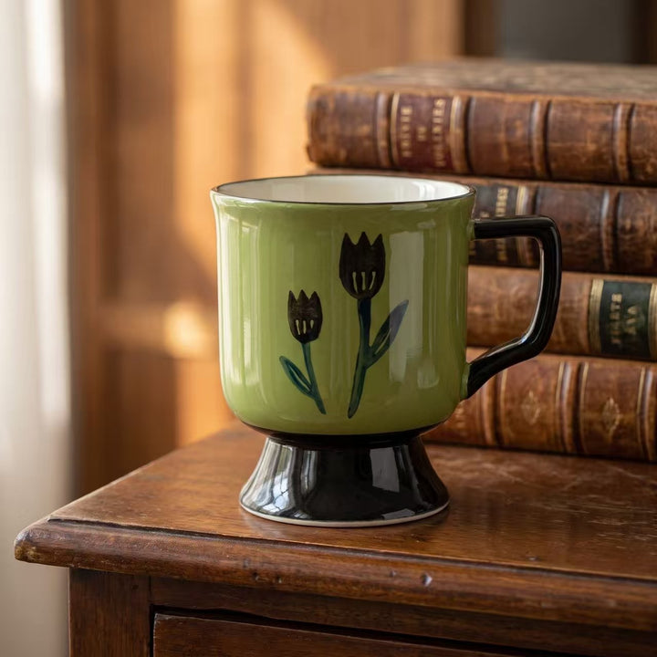 Ceramic cup with foot and hand-painted tulip motif