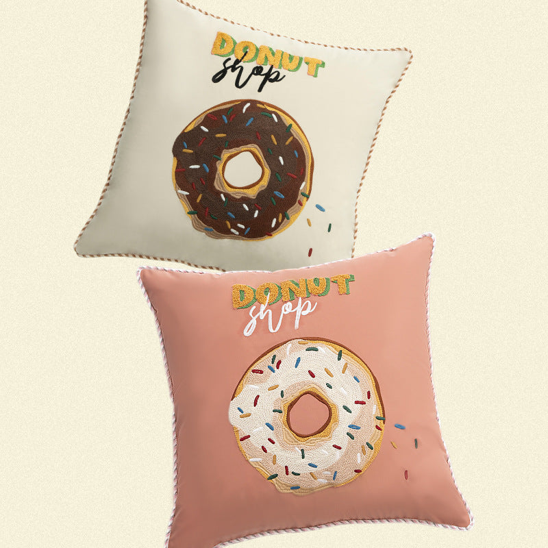 Square decorative pillow cover with hand-embroidered donut appliqué and piping Kalsten