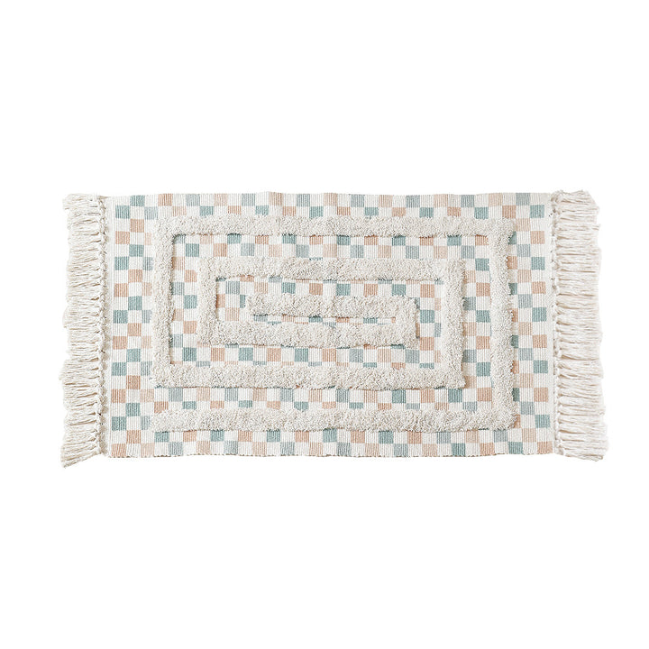 Hand-tufted bathroom mat with fringes, decorative dot-and-dash pattern and non-slip backing Kalsten