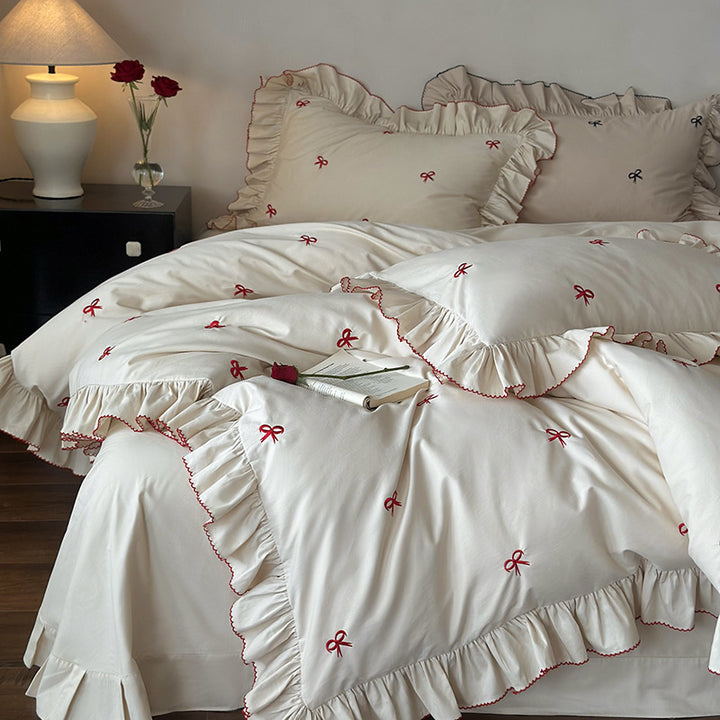 Luxurious bed linen set with ruffles and embroidered bows