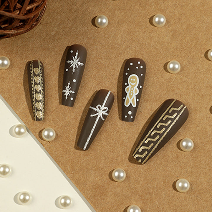 Artificial nail art with festive gingerbread design Kalsten
