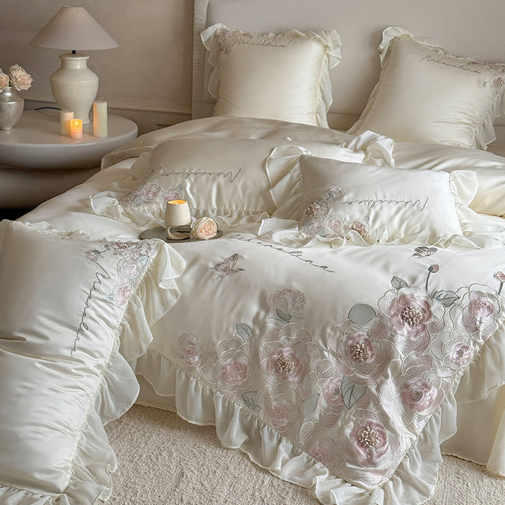 Luxurious satin bed linen set with relief-embroidered rose appliqués and ruffles