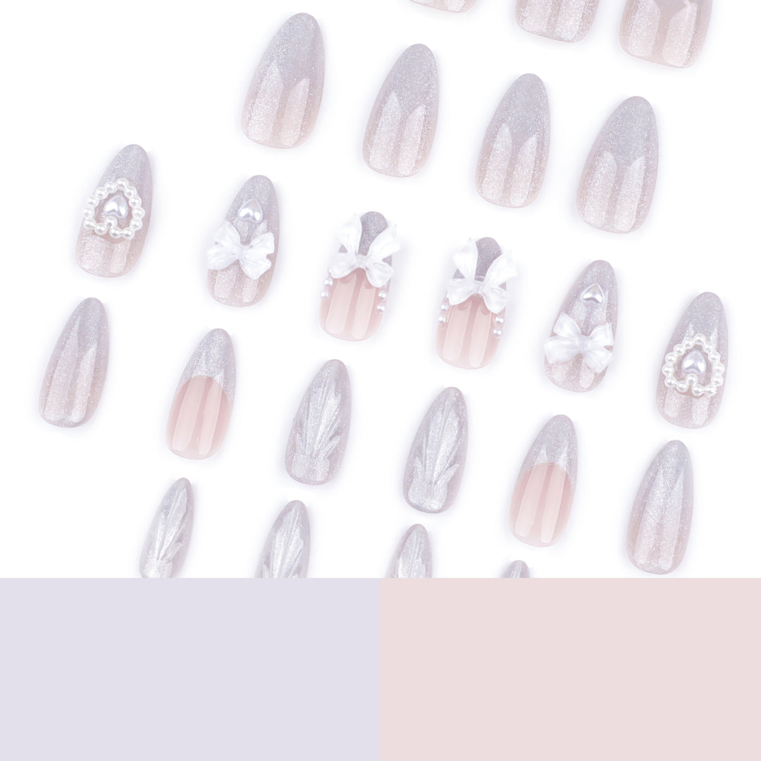 Artful nail decoration with pearl and bow accents Kalsten
