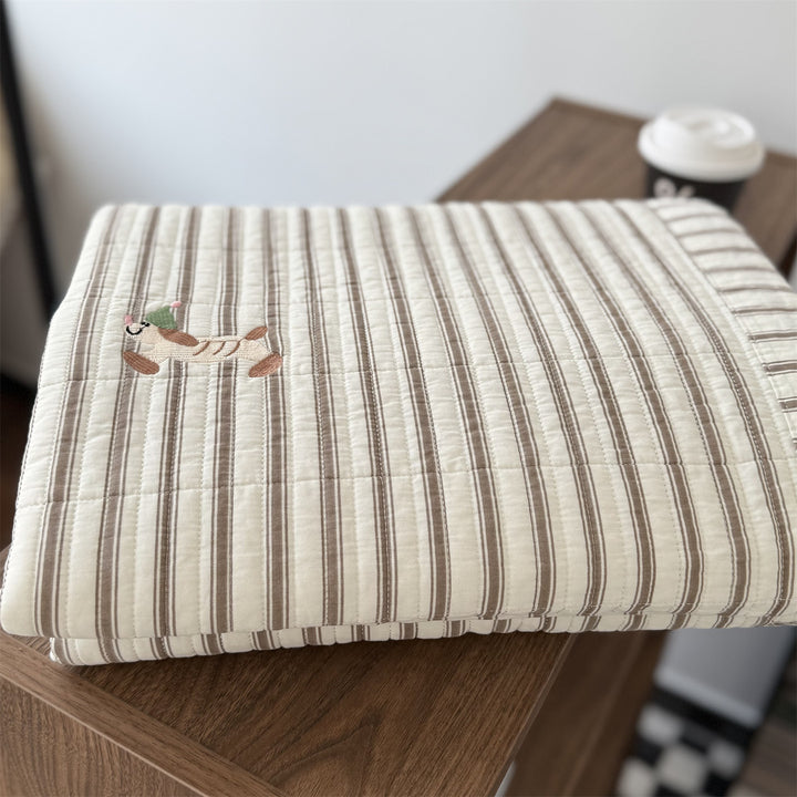 Quilted cotton bedspread with fine striped texture and cherry embroidery