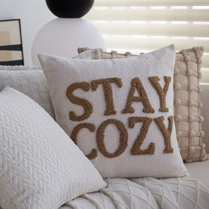 Square decorative cushion cover made of mottled boucle linen structure with fine piping Kalsten