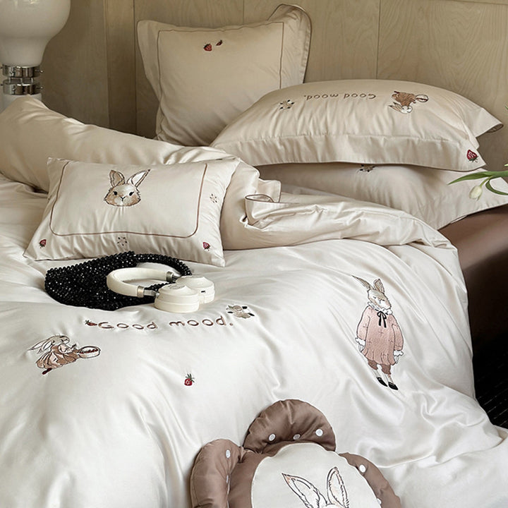 Fine cotton satin bedding set with elaborate bunny embroidery and piped edge
