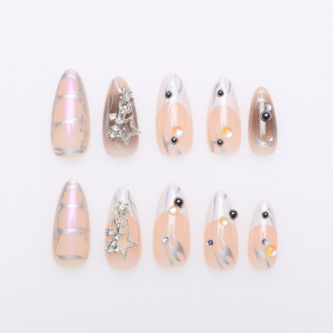 Artistic Stiletto Nail Extensions with Metallic Accents Kalsten