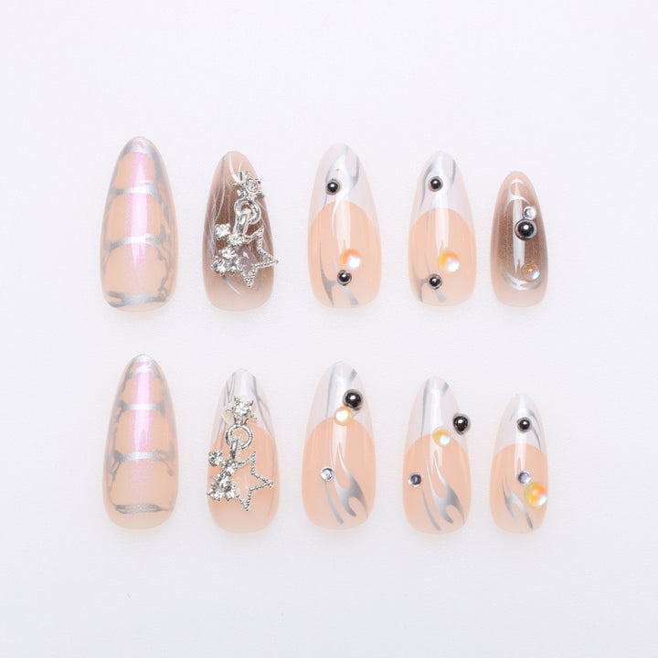 Artistic Stiletto Nail Extensions with Metallic Accents Kalsten