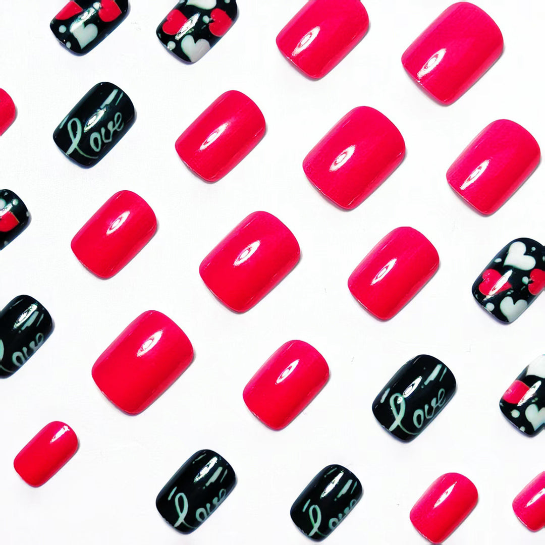 Acrylic nail design with hearts and kiss motifs Kalsten
