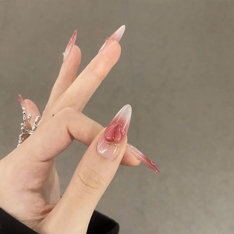 Nail set in elegant ombre design with artistic accents Kalsten