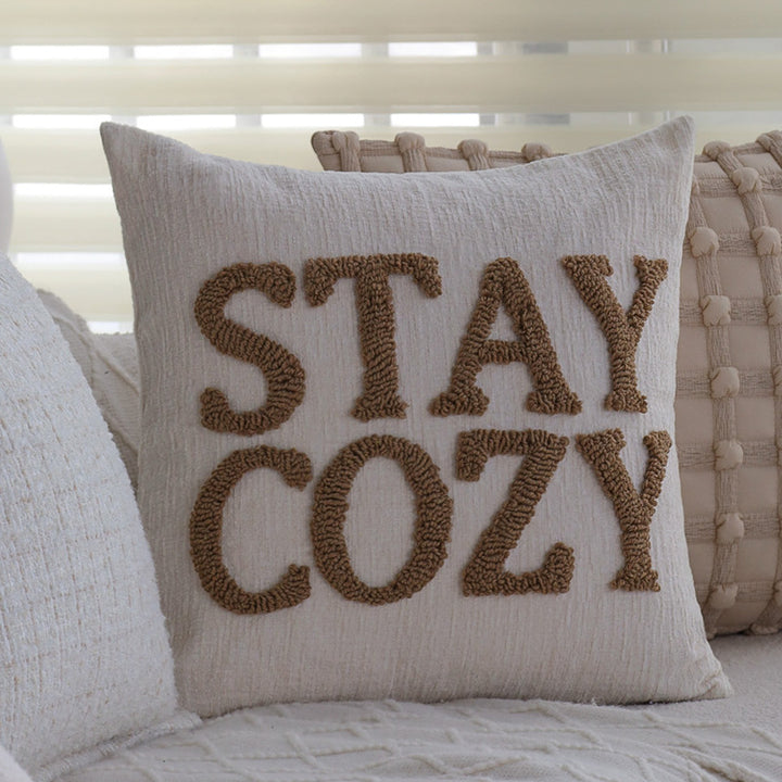 Square decorative cushion cover made of mottled bouclé weave with subtle piping Kalsten