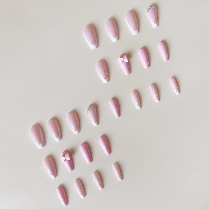 Artificial nail set with playful bows and glitter accents Kalsten