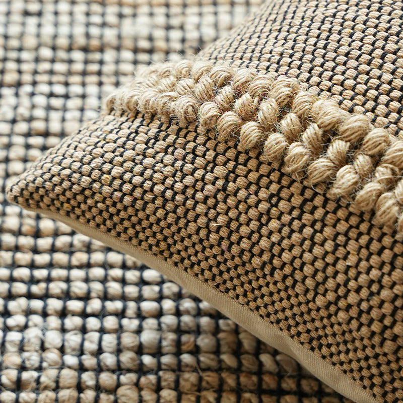 Handwoven structured cushion cover made of cotton blend with pompom trim Kalsten