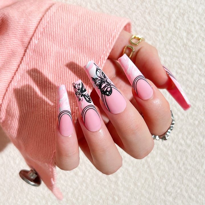 Artificial nail art with delicate butterfly designs Kalsten