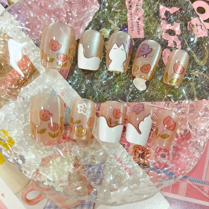 Artistic nail tips with floral motifs Kalsten
