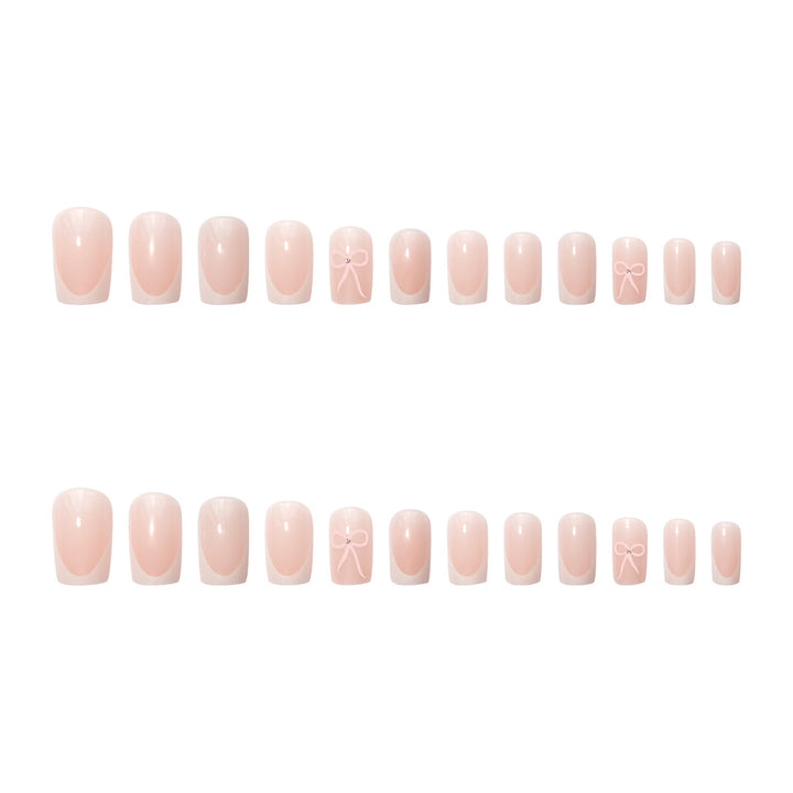 Nail art set with elegant bow and glitter accents Kalsten