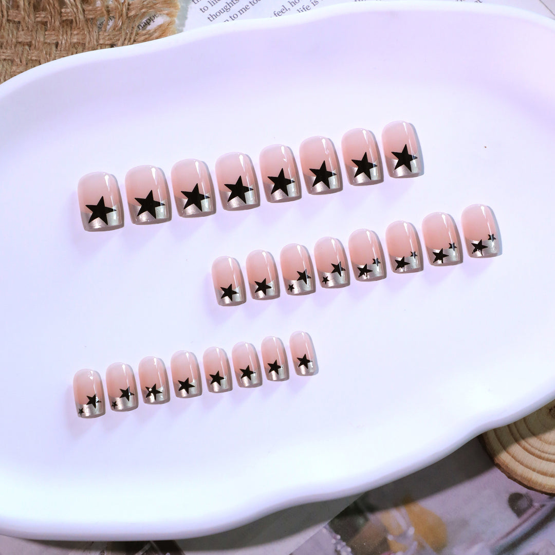 Sparkling nail art with stars and glitter accents Kalsten