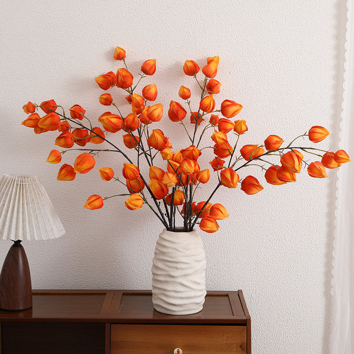 Artificial flower branch with vibrant flowers