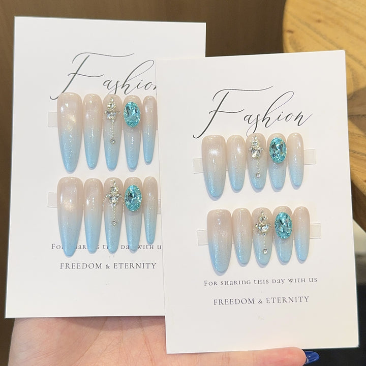 Glamorous artificial nails with sparkling rhinestone details Kalsten