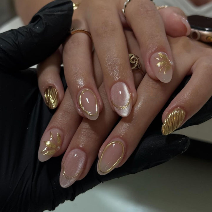 Elegant and artistic nail art with golden accents Kalsten