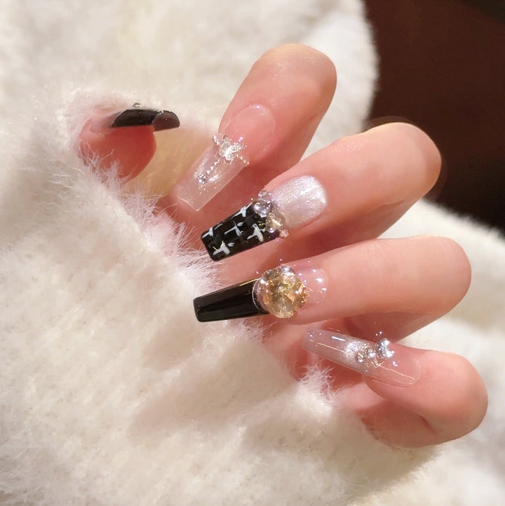 Artistic Stiletto Press-On Nail Art with Glimmering Accents Kalsten
