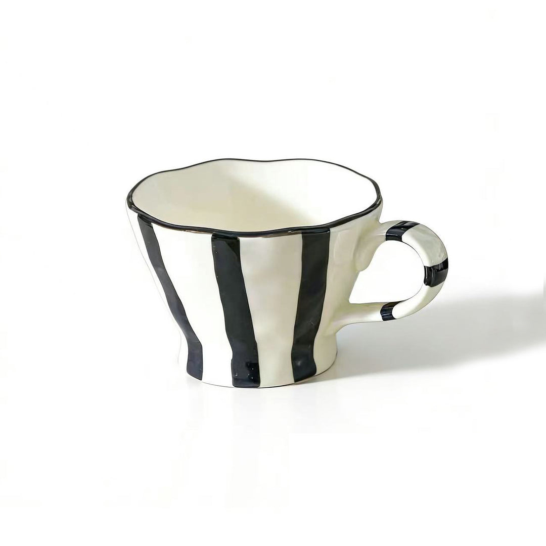 Designer stoneware coffee mug with scalloped rim and vertical brushstroke
